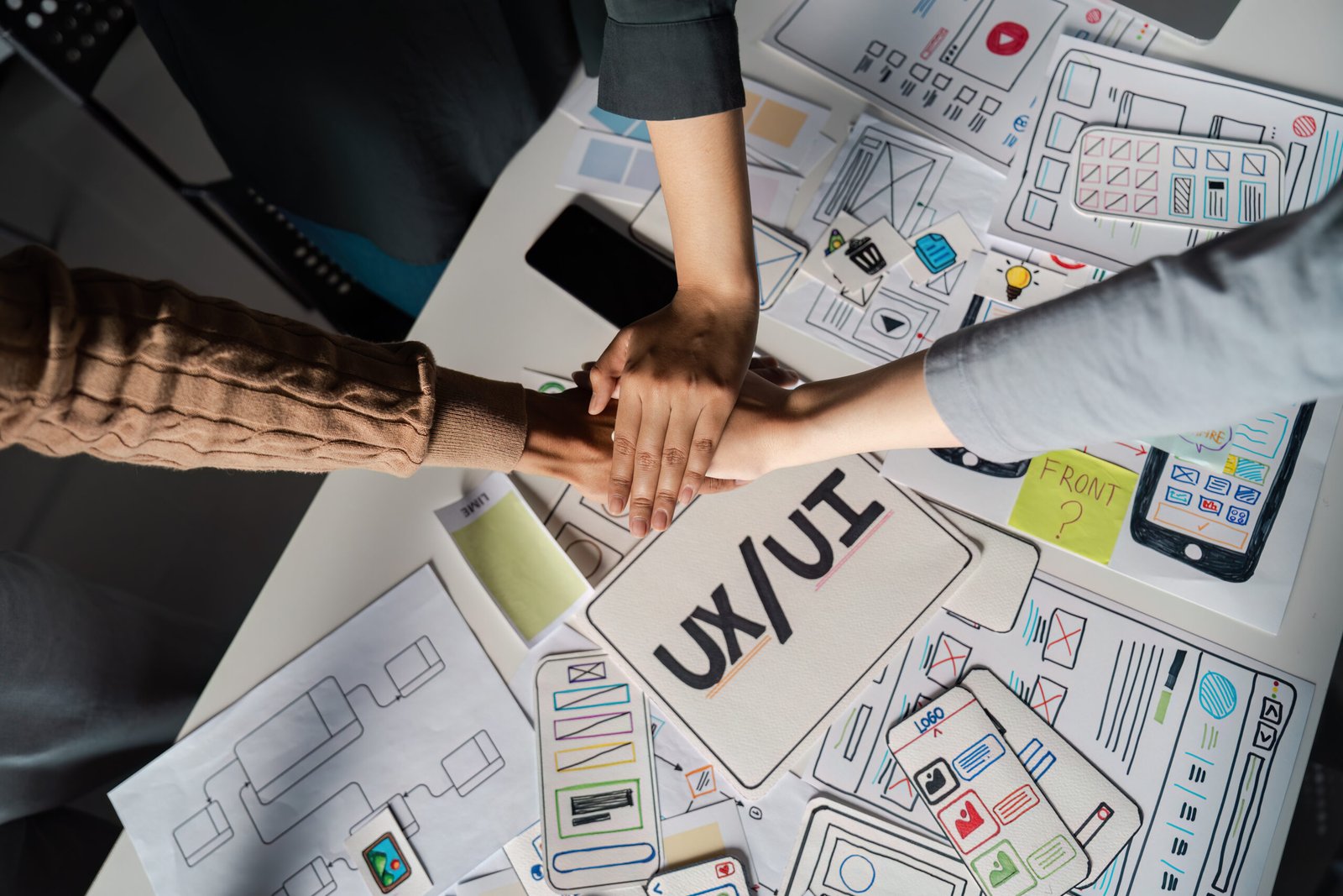 Diverse team engaged in a dynamic Ux UI design brainstorming session, fostering creativity and innovation.