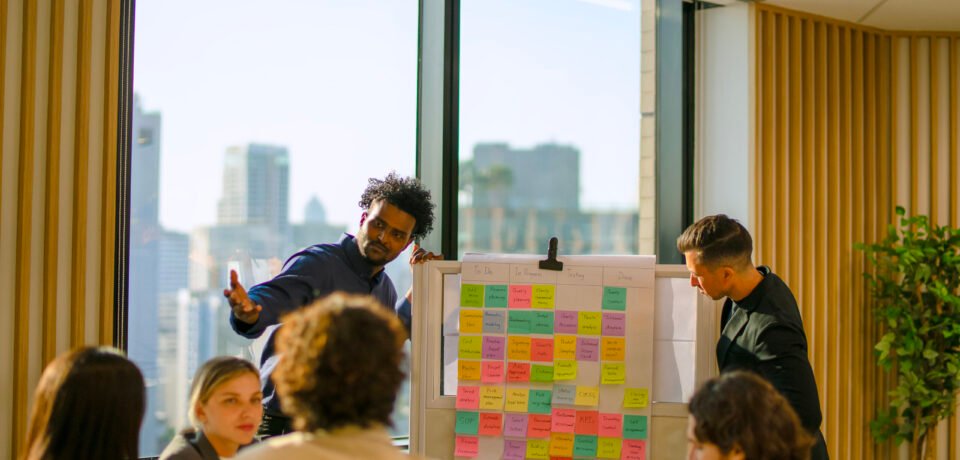 Group of white collar workers meeting at office. Significance of the User Stories for Effective App Development