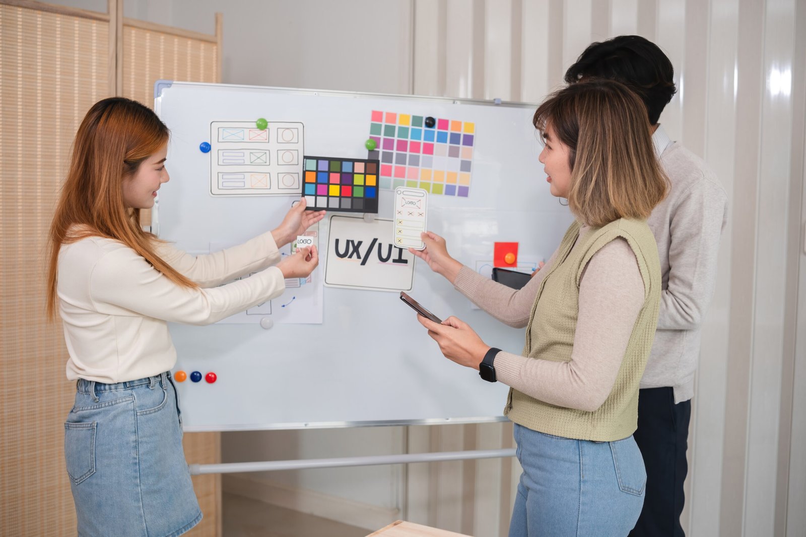 The application development team meets to discuss work plans and plans on the board. Brainstorm ideas for making ux ui to develop programs.