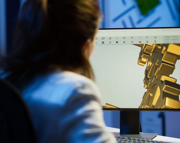 Focused architect working at new project using pc doing overtime Focused woman architect working at new project using computer doing overtime at night sitting at desk in start-up office. Industrial female engineer studying on pc showing cad software in midnight