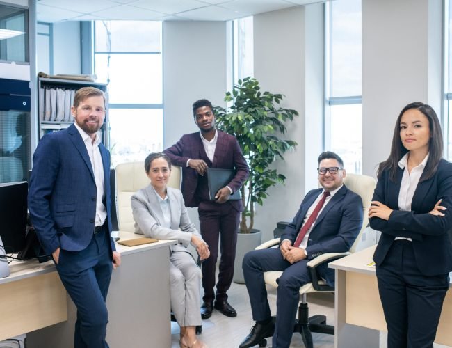 Large group of young successful intercultural office workers Large group of young successful intercultural white collar workers in open space office