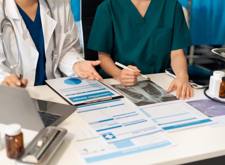 Medical team working on digital tablet healthcare doctor technology tablet using computer analyzed the results of medical reports, an online conference at the hospital.